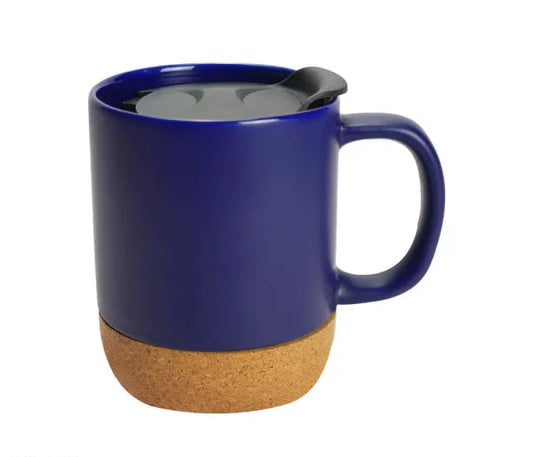 Dark blue ceramic mug with cork base on a white background