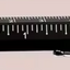 Mechanical pencil with ruler and stylus on a pink background