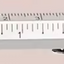 Mechanical pencil with ruler on a pink background